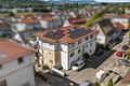Stilvolles Wohnen auf höchstem Niveau - Exklusive 3,5 Zimmer-Erdgeschosswohnung mit Traumterrasse - Außenansicht