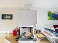 Schöne Maisonette-Dachgeschosswohnung in einem kleinen Mehrfamilienhaus mit nur 6 Einheiten in Solln - Holzkamin im Wohnbereich