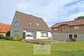 Einfamilienhaus mit Garage und Geräteraum in Wehdel - Gartenansicht