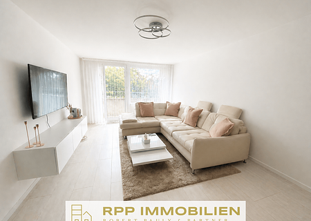 Stilvolle Split-Level-Wohnung mit Blick ins Grüne in Unterschleißheim - Wohnbereich