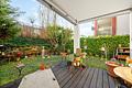 Wohlfühloase im beliebten HN-Osten – ideale 4-Zi.-EG ETW mit überdachter Terrasse - Überdachte Terrasse mit Markise
