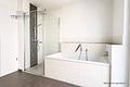 Moderne und lichtdurchflutete 3-Zimmer-Wohnung mit Sonnenbalkon und Tiefgaragenstellplatz - Bad