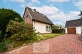 EFH mit großen Garten, Garage und viel Potenzial am Schiffdorfer Grenzweg - Seitenansicht mit Garage'