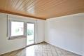 Sanierungsbedürftiges Zweifamilienhaus mit 174 qm Wohnfläche auf 649 qm großem Grundstück in ruhiger Wohnlage - EG Zimmer