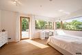 Moderne Architektenvilla mit exklusivem Interior-Konzept, Lift, Spa-Lounge, Home-Gym und Outdoorpool - Schlafzimmer mit angrenzender Süd-West-Terrasse