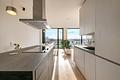 Friends Tower 2: Lichterfüllte, ideal geschnittene 2-Zimmer-Wohnung mit Concierge und Rooftop - Wohnen/Essen/Kochen vereint