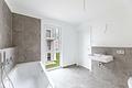 HEGERICH:  Zwischen Stadt & Natur: Moderne 4-Zimmer-Wohnung mit Komfort in Boxdorf - Badezimmer
