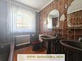 Lichtdurchflutete 4,5-Zimmer-Wohnung mit Süd-Balkon und Privatgarten in Lohhof - Badezimmer