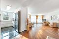 Großzügige, moderne 3-Zi.-Wohnung mit Südwestbalkon im begehrten Bogenhausen - Wohnzimmer mit offener Küche