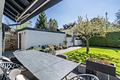 Exklusive Doppelhaushälfte mit sonnigem Südwest-Garten in Forstenried - Garten mit direktem Zugang zur Garage