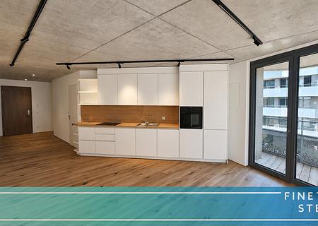 Designstarke Wohnung mit großem Balkon und maßgefertigter Einbauküche - FINESTEP Immobilien