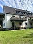 3-Zimmer-Wohnung mit Sonnenterrasse, 400 m² Gartenanteil und beheizten Hobby-Raum in Unterföhring! - Aussenansicht
