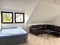 HEGERICH: Attraktive 3-Zimmer-Dachgeschosswohnung mit Terrasse in Oberasbach - Wohnzimmer