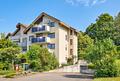 Moderne 4-Zimmer-Wohnung mit zwei Balkonen, Klimaanlage, Tiefgaragenstellplatz und Gartennutzung - Hausansicht
